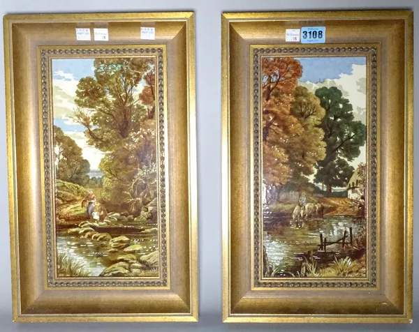 A pair of mid-20th century painted ceramic tiles, depicting river scenes within gold painted frames, 39cm x 24cm.