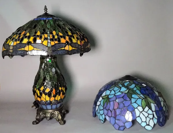 A modern Tiffany style table lamp and shade of typical design, 46cm wide x 63cm high, together with a similar shade, 40cm wide.