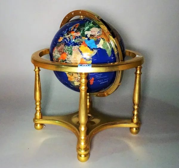 A modern table top terrestrial globe formed from specimen stone with gilt brass base, 34cm wide x 38cm high.