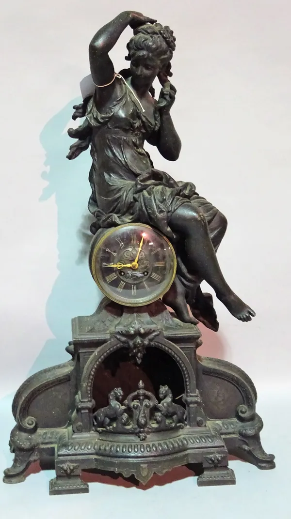 An early 20th century spelter figural mantel clock, 45cm wide x 74cm high.