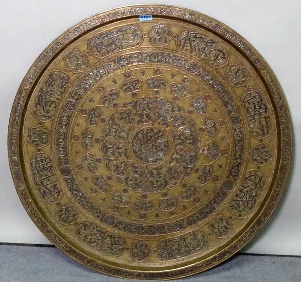 An early 20th century Egyptian style brass circular tray, 75cm diameter.