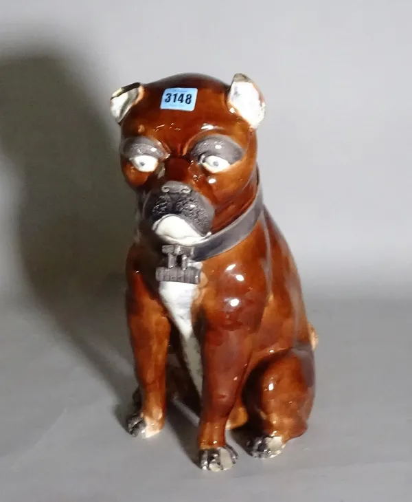 A late Victorian brown glaze pottery figure of a dog, 44cm high. (a.f.)