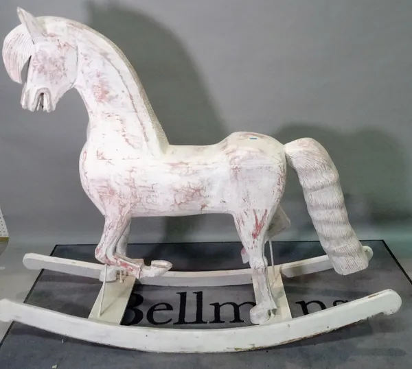 A modern white painted rocking horse of large proportions, 190cm wide x 149cm high.