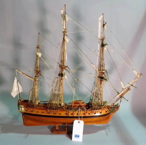 A modern wooden model of a triple mast galleon, within a modern stained beech framed glass display case, 90cm wide x 95cm high.