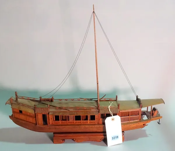 A modern hardwood model of a Chinese Junk, 63cm wide x 53cm high.