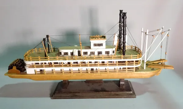 'The Queen of Mississipi', a modern wooden model of a paddle boat, 70cm wide x 35cm high.