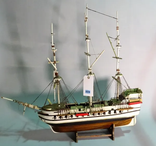 A modern wooden model of a triple mast galleon, 84cm wide x 80cm high.