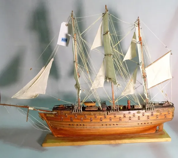 A modern wooden model of a triple mast galleon, 80cm wide x 78cm high.