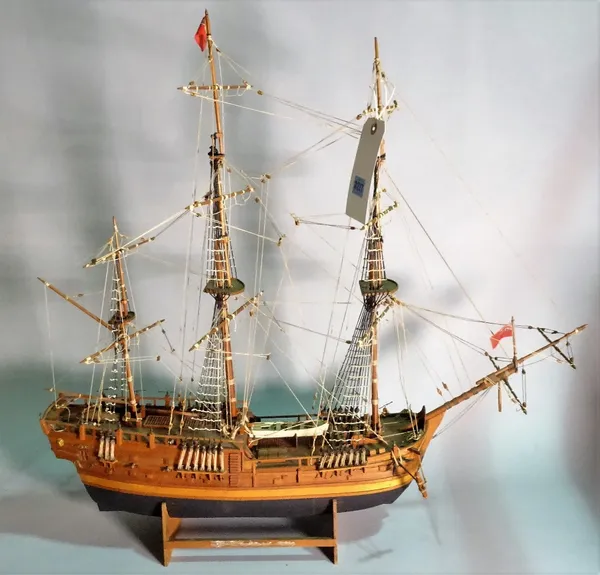 An early 20th century wooden model of a triple mast galleon, 79cm wide x 71cm high.