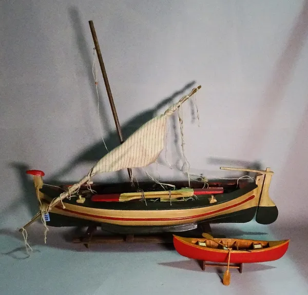 A modern wooden model of a sailing boat, 81cm wide x 26cm high. (a.f.)