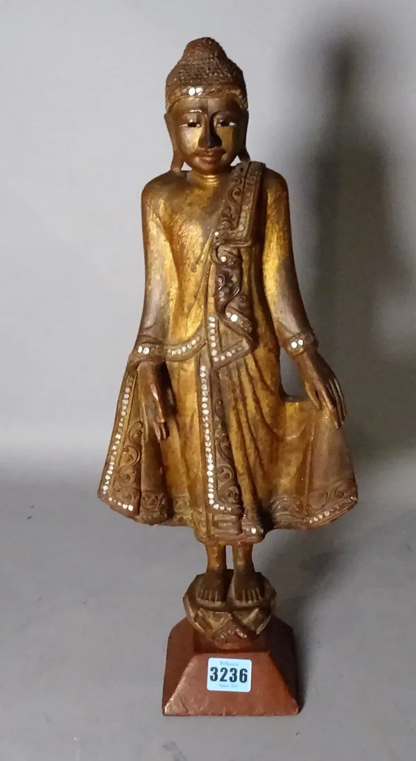 An early 20th century painted hardwood figure of a Thai Buddha, 47cm high.