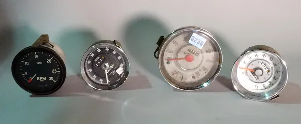 Automobilia, a collection of three 20th century Smiths speedometers, one from a mini, and a Smiths Rev counter.