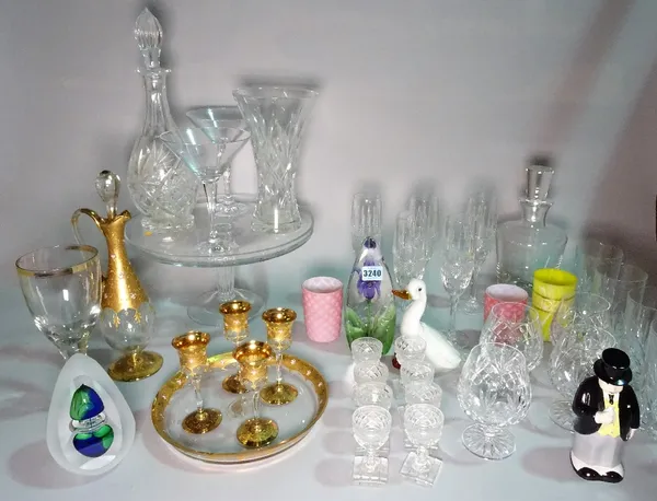 A large quantity of mostly 20th century cut glass, including, drinking glasses, decanters and vases and a group of glass paperweights and sundry. (qty