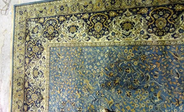 A mid-blue Wilton machine made Persian style carpet, 460cm x 318cm.