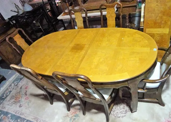 A modern Chinese simulated elm oval extending dining table, two extra leaves, 162cm wide x 78cm high, 238cm fully extended, and a matching set of six