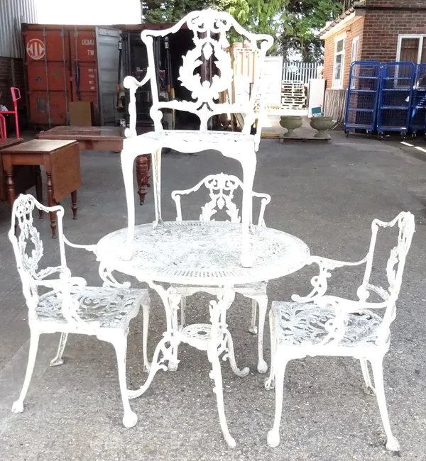 A modern white painted aluminium circular garden table, 80cm diameter x 69cm high, and matching four open armchairs, 45cm wide x 80cm high. (5)