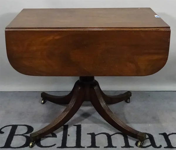 A 19th century mahogany flap side table on turned column and outswept supports, 87cm wide x 73cm high.