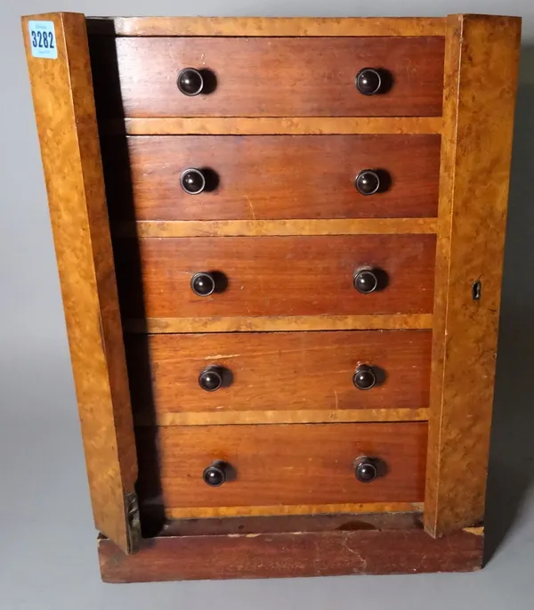 A miniature 19th century mahogany and birds eye maple five drawer Wellington chest, 32cm wide x 45cm high.