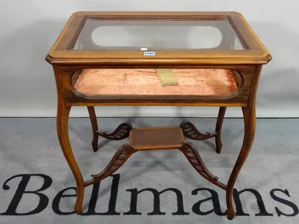 An Edwardian satinwood banded mahogany vertu table, on cabriole supports, 67cm wide x 71cm high.