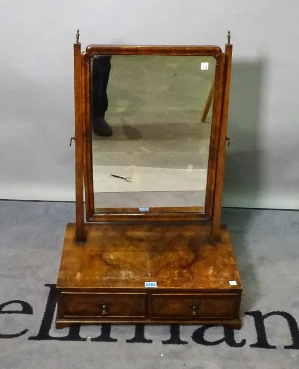 A 19th century walnut toilet mirror, with two frieze drawers on bracket feet.