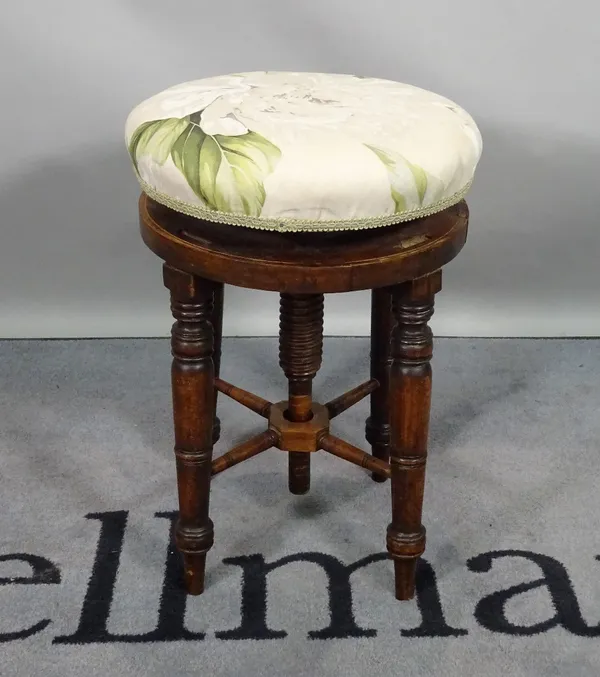 A late Victorian mahogany height adjustable piano stool, on ring turned supports, 37cm high x 48cm high.