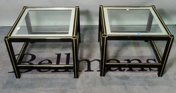 In the style of 'Pierre Vandell' a pair of modern black lacquer and brass inlaid side tables with glass tops, 48cm wide x 38cm high. (2)