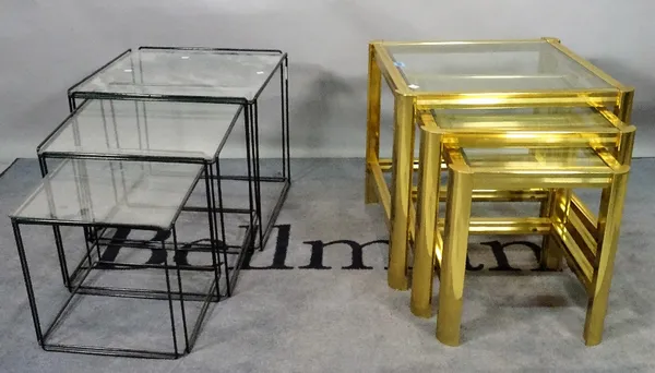 A modern brass and glass nest of three tables, the largest 50cm wide x 64cm high, and another modern black painted metal and glass nest of three table