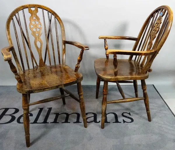 A set of six 18th century style stained beech wheelback chairs, to include two carvers, 55cm wide x 95cm high.