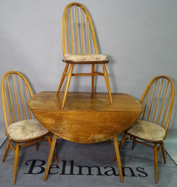 Ercol, a 20th century elm circular drop flap dining table, 113cm wide x 71cm high, and a matching set of four stained beech and elm dining chairs, 42c