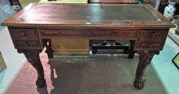 A Victorian mahogany writing desk, with three frieze drawers on cabriole supports, 133cm wide x 74cm high.