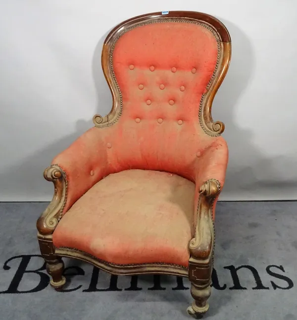 An early Victorian mahogany framed spoonback armchair, on turned supports, 70cm wide x 105cm high.