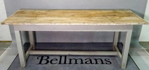 An early 20th century pine work table, with grey painted base, 197cm wide x 78cm high.