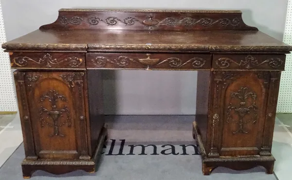 A Regency style mahogany inverted breakfront pedestal sideboard, with three frieze drawers over moulded panelled doors, 182cm wide x 115cm high.