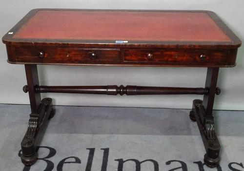 A late Victorian mahogany writing desk, with two frieze drawers and a tooled leather top, 107cm wide x 79cm high.
