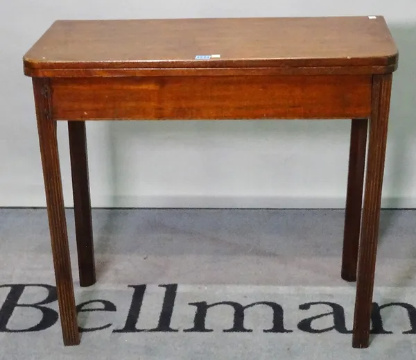 A late George III mahogany foldover tea table, on fluted block supports, 82cm wide x 73cm high.