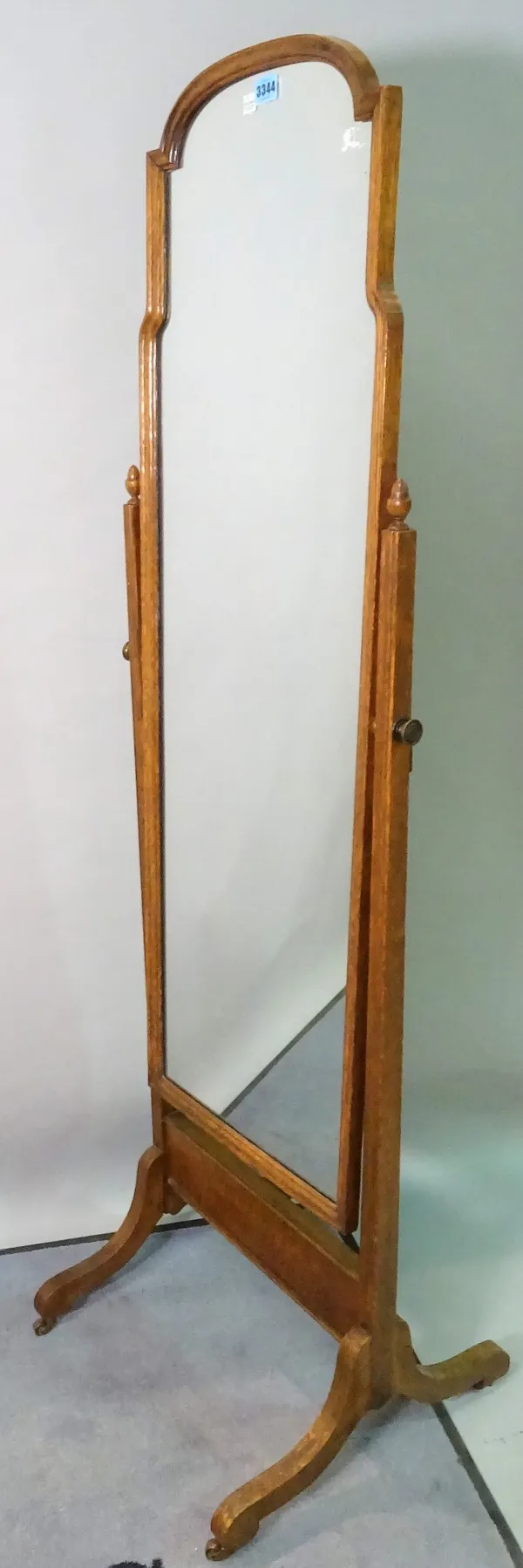 An early 20th century oak arch top cheval mirror, 48cm wide x 160cm high.