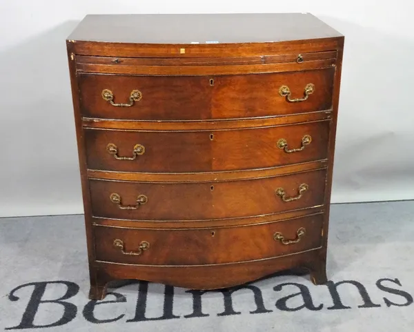 A Regency style mahogany bowfront chest, the brushing slide over four long graduated drawers on splayed bracket feet, 76cm wide x 82cm high.