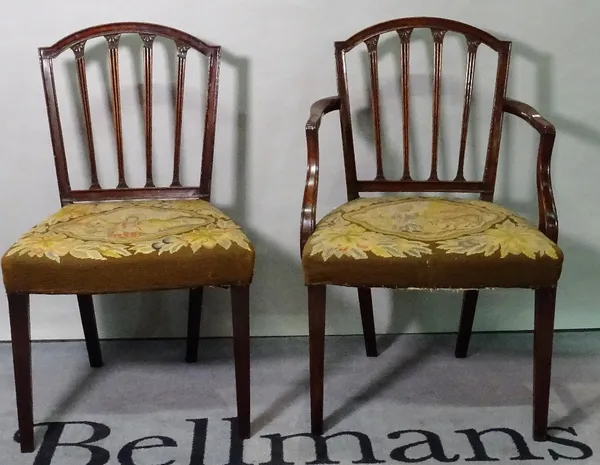 A set of six George III mahogany stick back dining chairs, to include one carver, 56cm wide x 88cm high. (6)