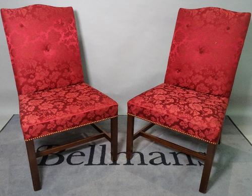 A set of six George III style hump back dining chairs, on canted mahogany supports, 58cm wide x 101cm high.