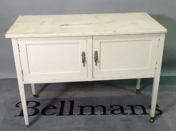 A late Edwardian white painted marble topped washstand, on tapering square supports, 107cm wide x 76cm high.