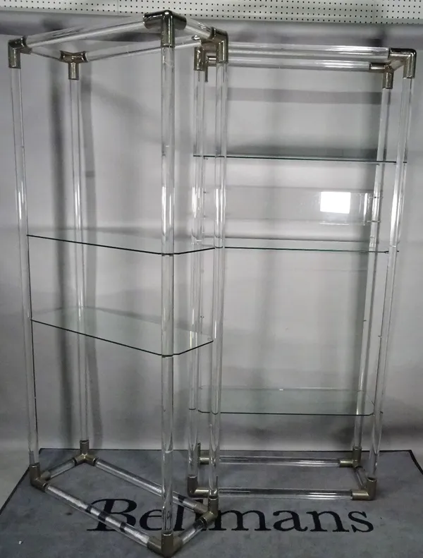 A set of three modern acrylic and chrome three tier open bookcases, of tubular form, 89cm wide x 203cm high. (3)