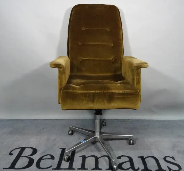 A mid-20th century hardwood framed office armchair, with brown upholstery on a chrome base, 72cm wide x 120cm high.