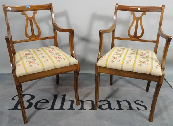 A pair of 19th century mahogany open armchairs, with lyre backs on sabre supports, 49cm wide x 86cm high, and a late Victorian faux rosewood standard