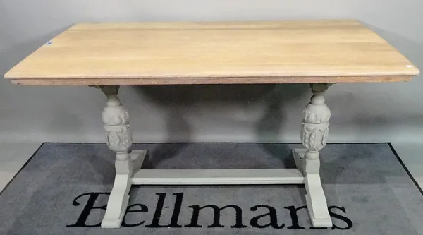 An 18th century style grey painted oak kitchen table, 143cm wide x 74cm high.