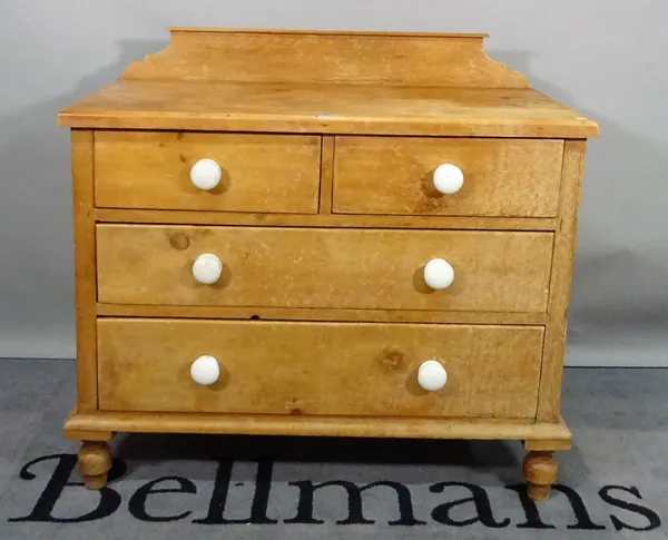 An early 20th century pine chest, of two short and two long graduated drawers, 97cm wide x 89cm high, and an early 20th century pine bedside cupboard,