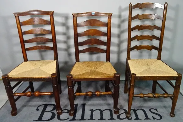 A matched set of six ash and elm ladder back dining chairs, 49cm wide x 86cm high.