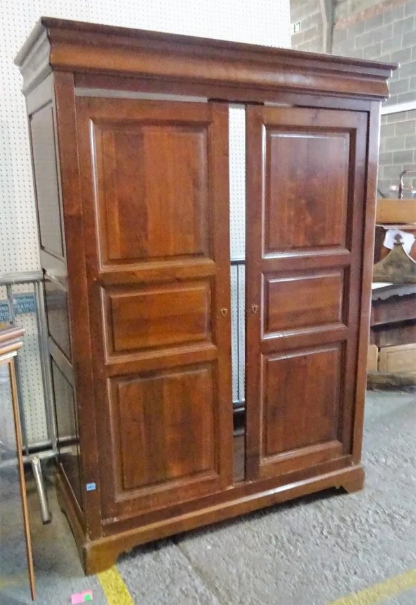 A modern French fruitwood two door armoire, 199cm high x 140cm wide.