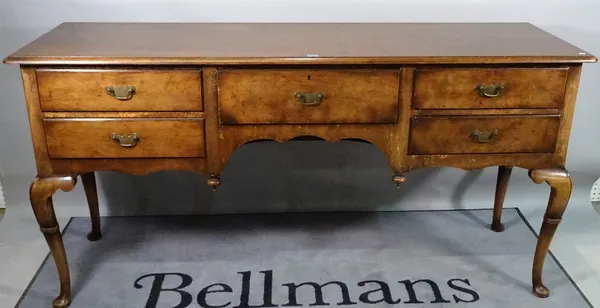 A George II style stained beech dresser base, on cabriole supports, 182cm wide x 93cm high.