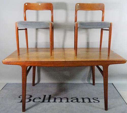 A mid-20th century teak extending dining table, with two extra leaves, 160cm long x 73cm high x 84cm wide x 248cm fully extended, and a matching set o