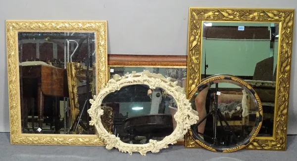 A group of four modern wall mirrors of various sizes, the largest 58cm wide x 81cm high, and an Edwardian overmantel mirror, 86cm wide x 54cm high.